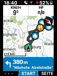 An ELEMNT's map screen with blue water-drop markers along the route and a café marker at a bend.