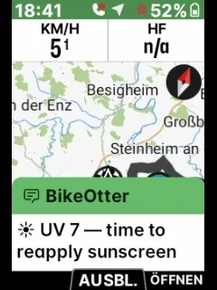 Una pantalla de Wahoo ELEMNT en plena salida con un mensaje de BikeOtter sobre el mapa: «UV 7 — time to reapply sunscreen».